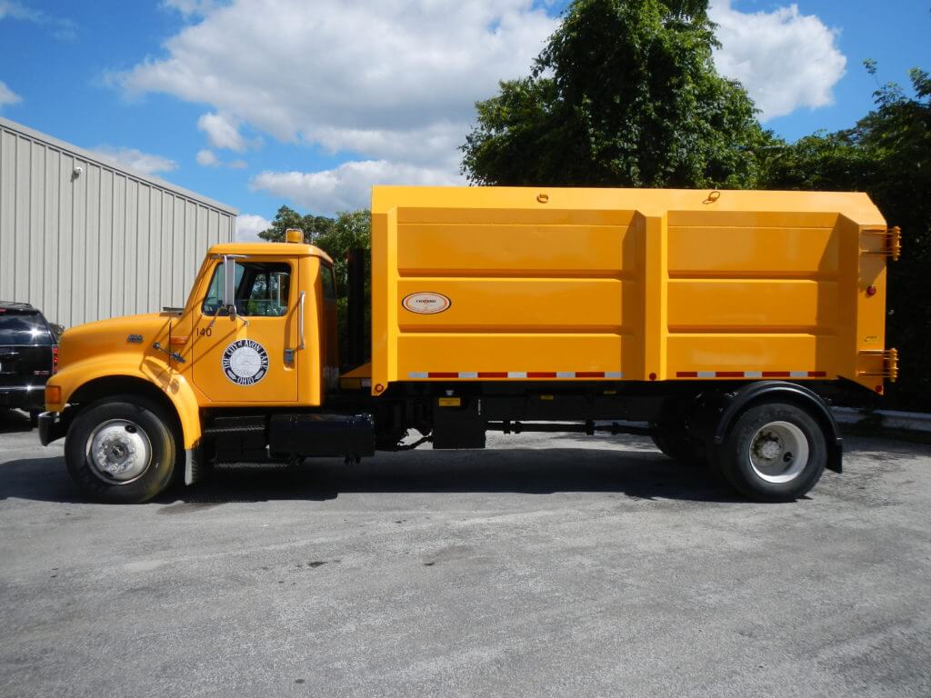 Concord Road Equipment Yellow Truck With Leaf Container Side