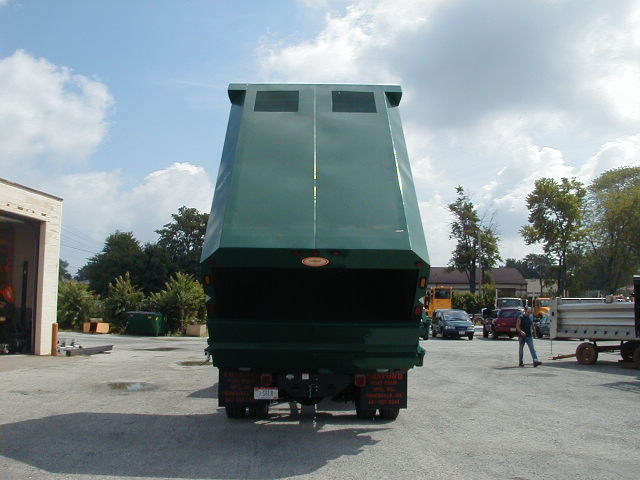 Concord Road Equipment Green Truck With Leaf Container Raised Rear