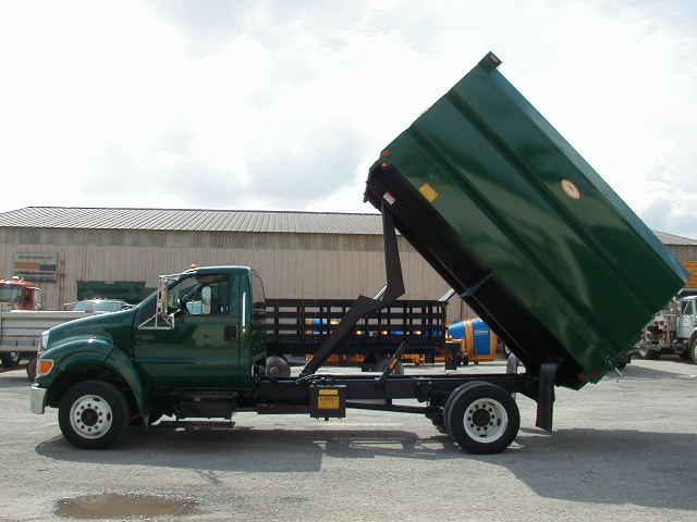 Concord Road Equipment Green Truck With Leaf Container Raised Side