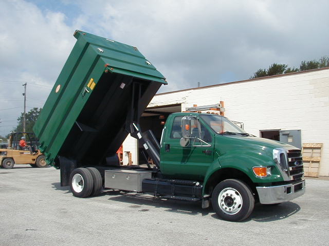 Concord Road Equipment Green Truck With Dump Bed Raised Side